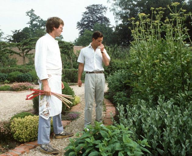 Then Prince Charles (above left) sniffs herbs as he walks around his walled fruit and vegetable...