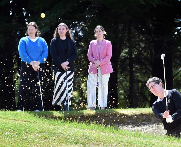 Otago Golf Club general manager Shelley Duncan hits out of a bunker at Balmacewen yesterday in...