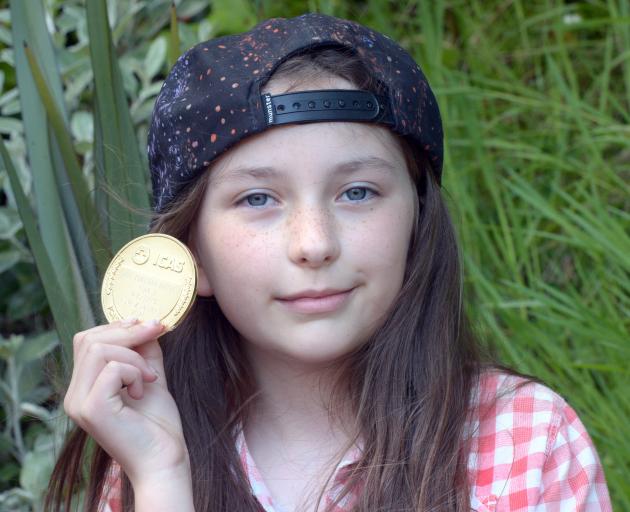 George Street Normal School pupil Ash Boraman-Ritchie earned a medal for coming first in New...