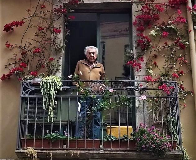 A local resident takes in the view in Taormina. PHOTO: MIKE YARDLEY