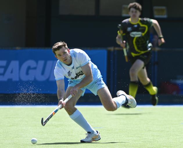 Alpiners player Mick Findlay controls the ball with Falcons player Matt Wilson at rear. PHOTO:...