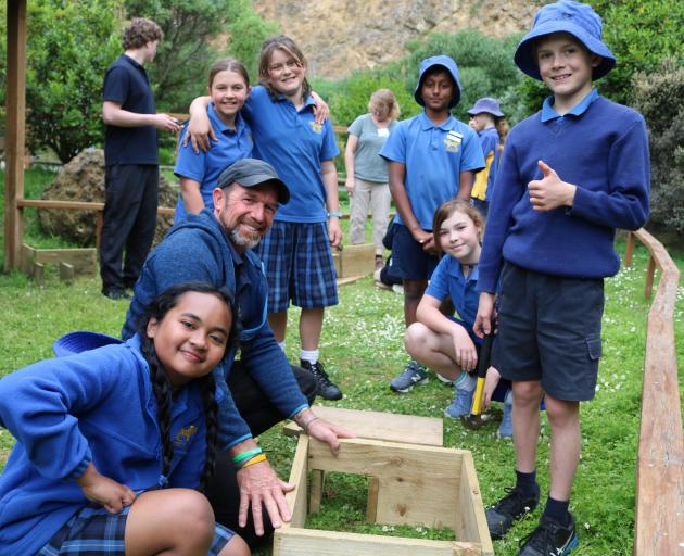 Putting sustainability lessons into action and learning to build penguin boxes with volunteer...