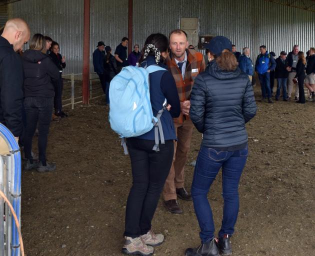 Veterinarian Dave Robertson listens to Laura Martingaste’s suggestion on how to manage parasites...