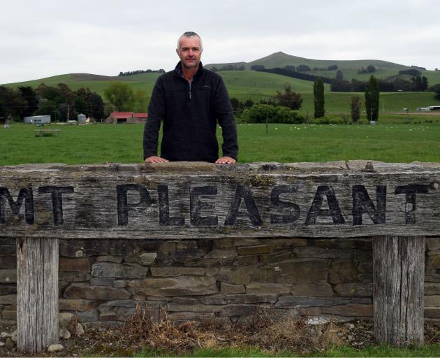 Mt Pleasant co-owner Rogan Borrie stands at the entrance of the sheep and beef farm he bought in...