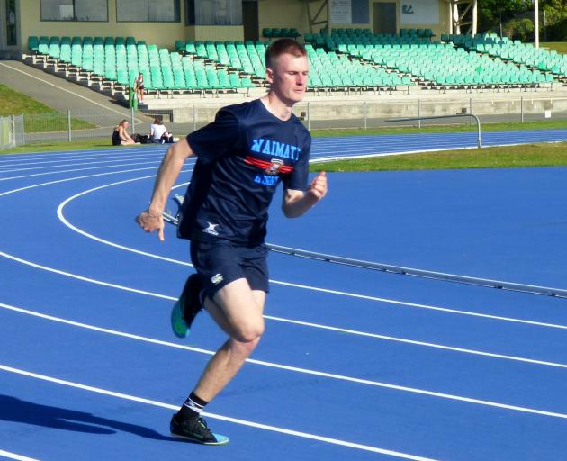 Waimate High’s Sam Hobart, 16, works hard to get ready for the 400m event at nationals.