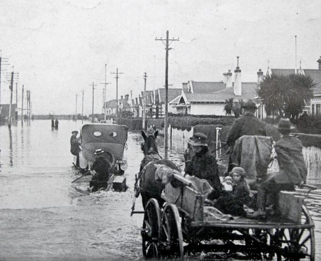 Residents of Queens Dr in Musselburgh leave their flooded homes.