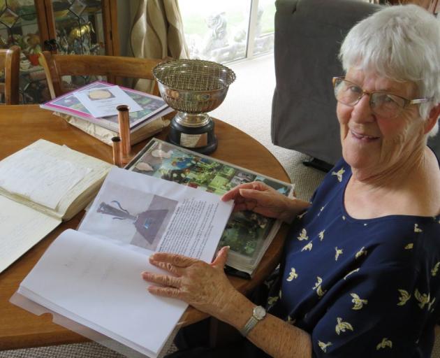Noella Talbot looks over the programmes, trophies and society’s history information since it was...