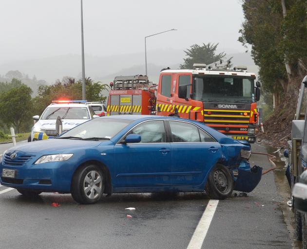 Emergency services at the scene of the crash this morning. Photo: Gregor Richardson