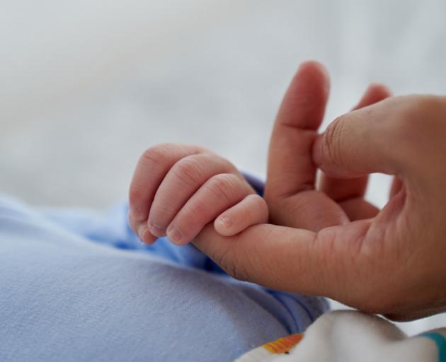 The man travelled to Thailand and paid a "significant" sum to secure a surrogate so he could have...