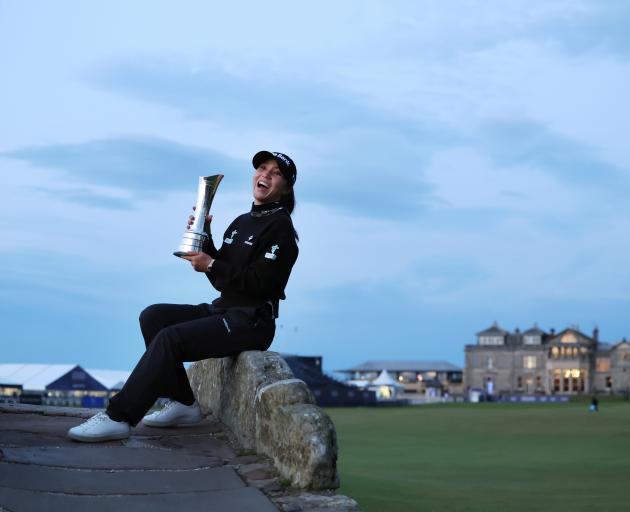 Dame Lydia poses with the AIG Women's Open trophy on the Swilcan Bridge at St Andrew's in August....