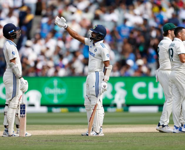 India's Akash Deep watches the DRS challenge after a delivery from Scott Boland and caught by...