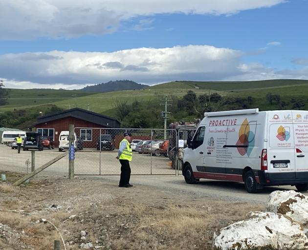 Security posted outside the entrance to the farm this morning. Photo: Craig Baxter 