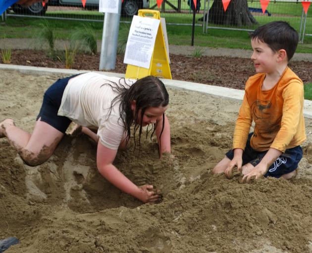 Willow, 8, and Eddie Roxburgh, 5, dig in. PHOTOS: NIC DUFF