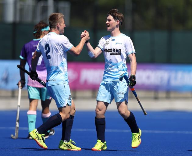 Alpiners players George Baker (left) and Patrick Ward celebrate during a Premier Hockey League...
