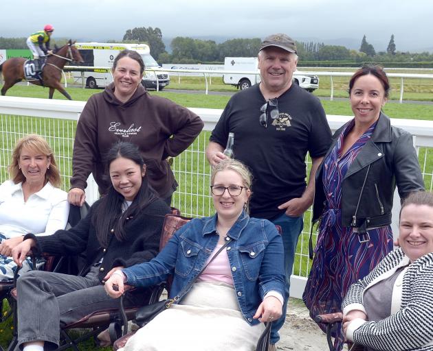 Relaxing by the track are (front, from left) Deb O’Driscoll, Sandy So, Madison Pannett, Veronica...