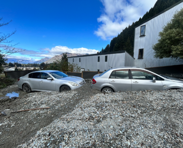 Properties and cars in Reavers Lane, Queenstown, affected by slips. Photo: RNZ