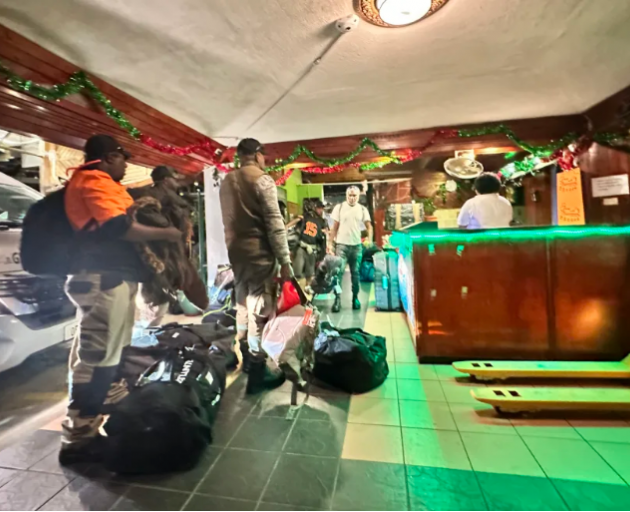 Vanuatu seasonal workers check into a hotel in Nadi to await the resumption of commercial airline...