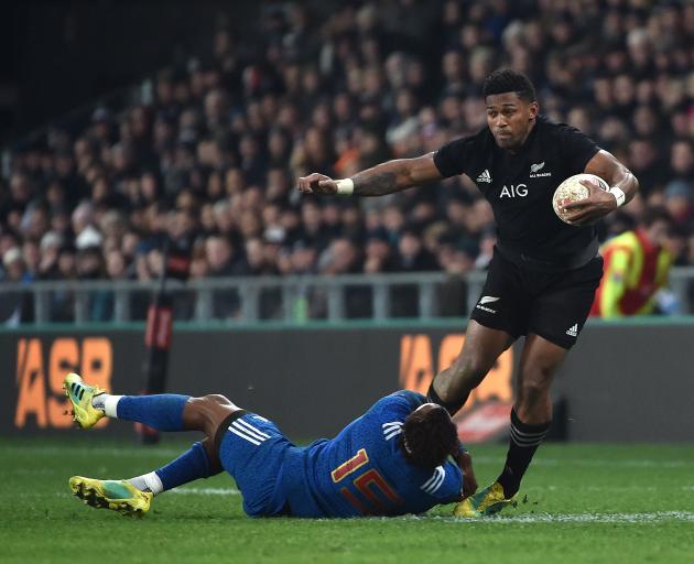 All Blacks winger Waisake Naholo tries to evade French fullback Benjamin Fall during the test in...