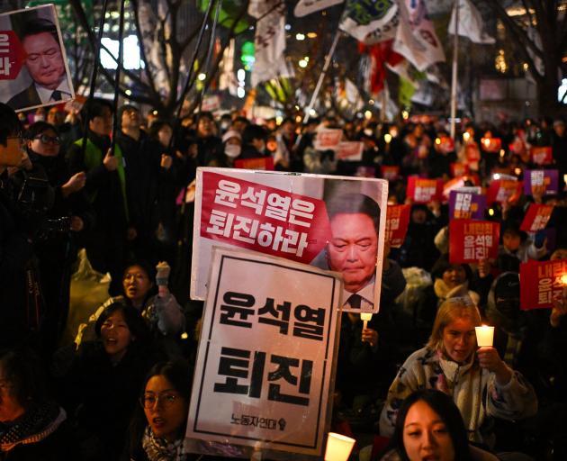 A candlelight vigil in Seoul calling for the resignation of South Korea President Yoon Suk Yeol....
