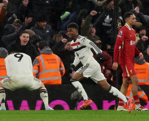 Manchester United's Amad Diallo celebrates his late equaliser against league leaders Liverpool....