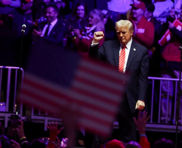 Donald Trump gestures to a packed rally on Sunday ahead of his inauguration as US President....