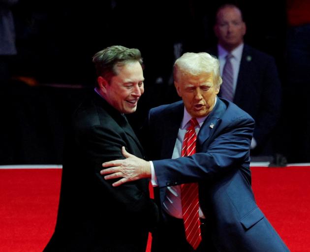 Donald Trump has the backing of the world's richest man Elon Musk, who joined him at a packed...