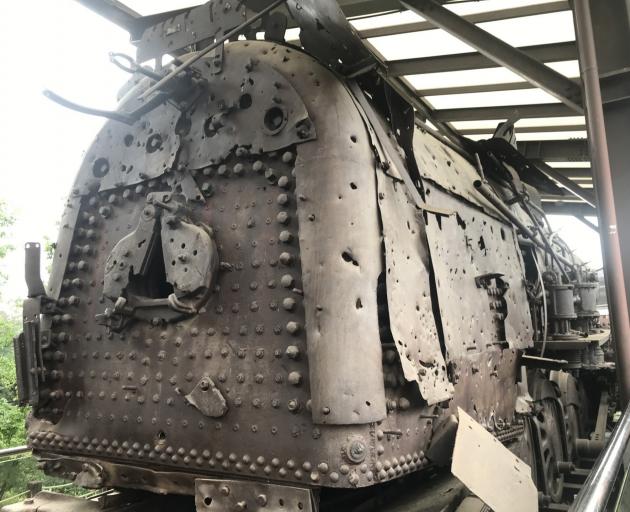 Riddled with bullet holes, this old train engine carried people to safety in the south.