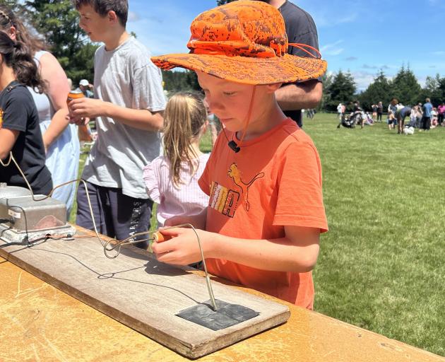 Frank Waters, 8, of Cromwell, may have a career in surgery as he aced the ding-a-ling game at the...