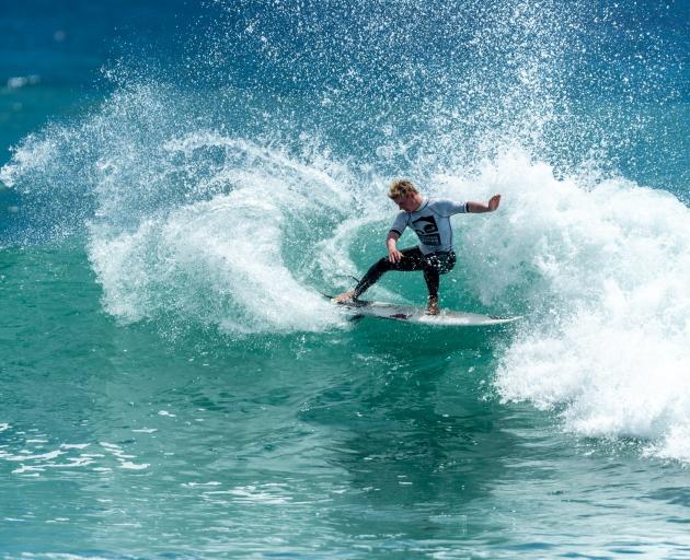 Dunedin surfer Alexis Owen charges to victory in the New Zealand national surfing championships...