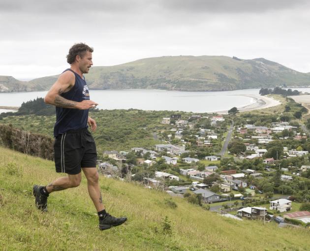 Wade McClelland, of Dunedin, heads for the finish line during the cliff race. He was the first...