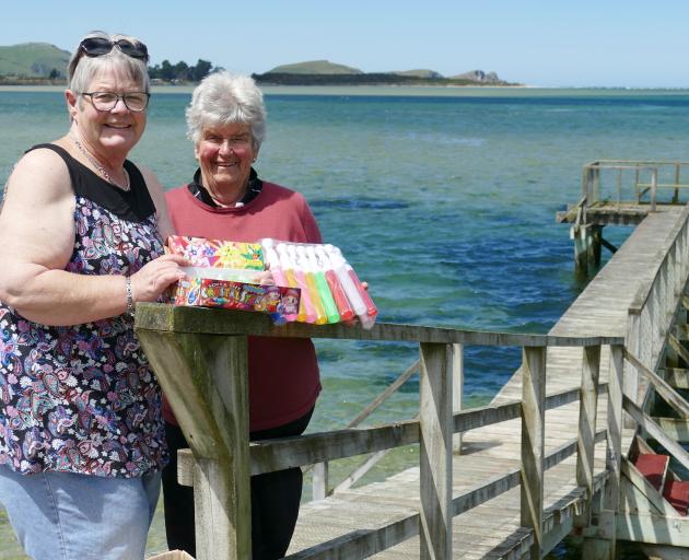 Pounawea Picnic Group members Linda Mason (left) and Annette Moore inspect a fresh box of...