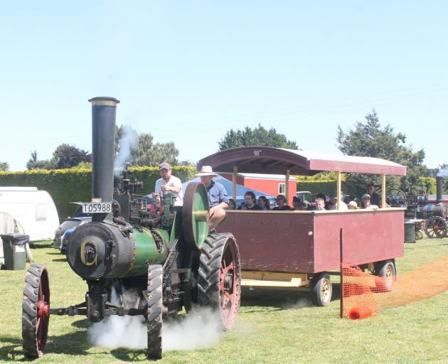 Tim Shanks (left) and Aaron Clarke were taking attendees of the Crank Up on steam engine rides,...
