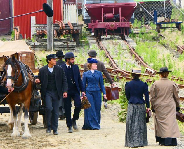 Hollywood actress Florence Pugh (centre, in blue), in character as Cathy Ames, walks beside actor...