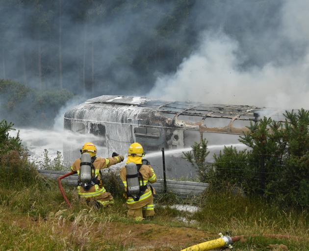 Firefighters work to contain the blaze. 