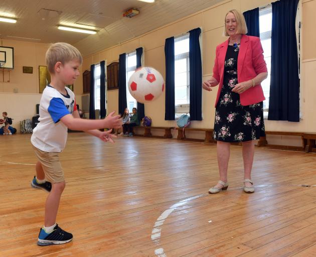 Andersons Bay School pupil Cooper Smith, 5, and principal Pauline Simpson play with a ball in the...