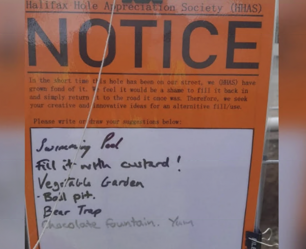 A notice from the "Halifax Hole Appreciation Society (HHAS)" that was affixed to temporary...