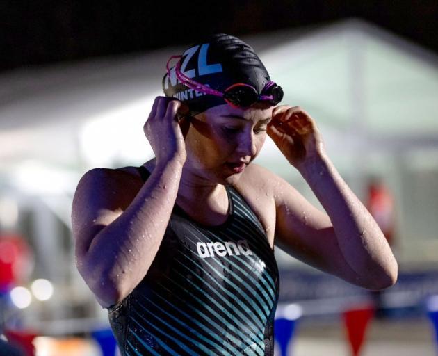 Ice swimmer Sophie Winter, of Alexandra, takes a moment during the world champs. PHOTOS: JAMES...