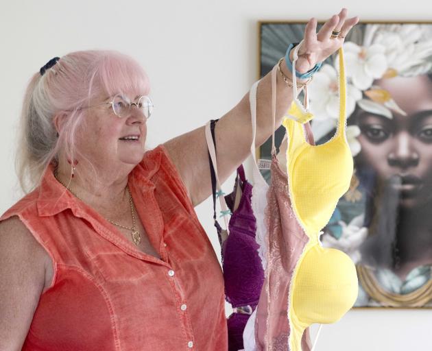 Semi-retired Mosgiel midwife Maureen Donnelly holds some of the bras she has collected for women...