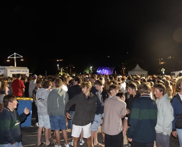 The Wānaka lakefront is packed with families and friends of all ages enjoying live music as they...