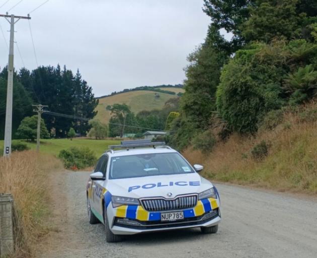 A police car which is stopping traffic on Hunt Rd, Clutha, this morning. Photo: Nick Brook