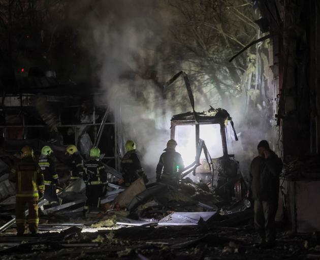The search for casualties after a rocket strike on Kyiv. PHOTO: REUTERS
