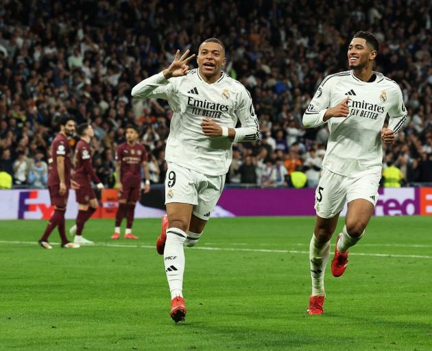 Real Madrid’s Kylian Mbappe (left) and Jude Bellingham celebrate Mbappe’s third goal against...