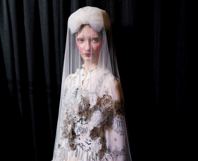 Bora Aksu designs featured structured coats and jackets with delicate, embroidered chiffon and...