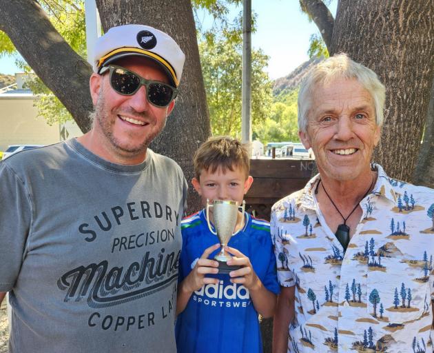 Kenny Frisby, left, his son Johnny, 8, and Ian Wilkins were the winners of the spud-growing...