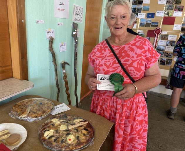 Donna Parker, of Roxburgh, displays her rosette for outstanding entry in the baking class at the...