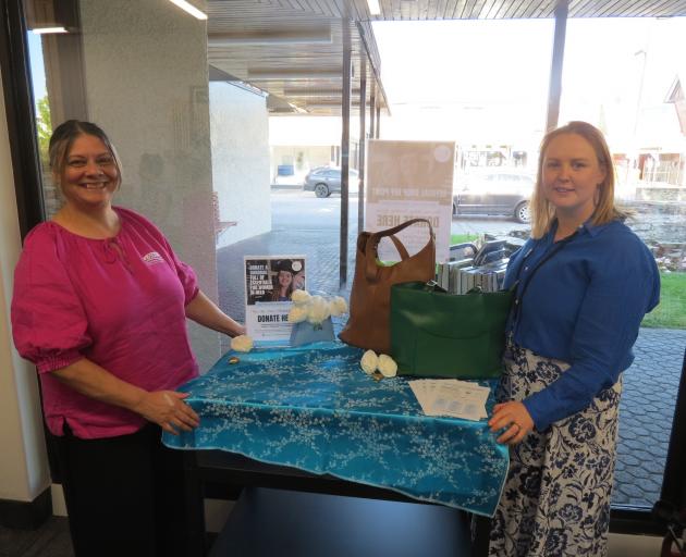 Alexandra Library team leader Moniza Fenton, left, and the Love Grace Handbag Appeal Central...