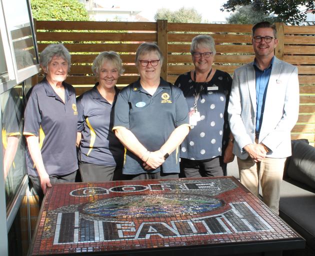 With the preserved mosaic, which now sits in the foyer of Gore Health, are (from left) Dot Walker...