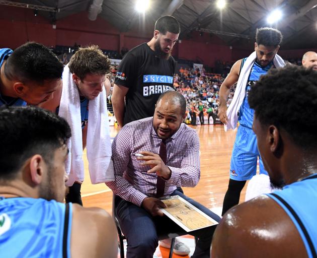 Breakers coach Kevin Braswell talks to his players during a timeout during an NBL match against...