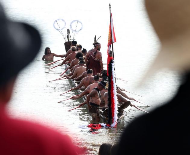 Waka arrive at the beach as part of Waitangi Day celebrations in the Bay of Islands yesterday....