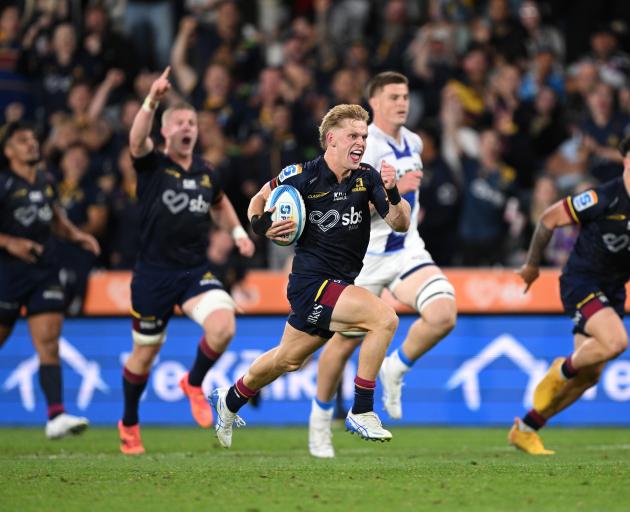 Finn Hurley of the Highlanders charges towards the tryline to score during tonight's Super Rugby...
